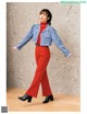 a woman in a blue jacket and red pants